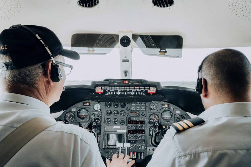 Photo by Amar Preciado: https://www.pexels.com/photo/back-view-of-pilots-on-cockpit-14186727/