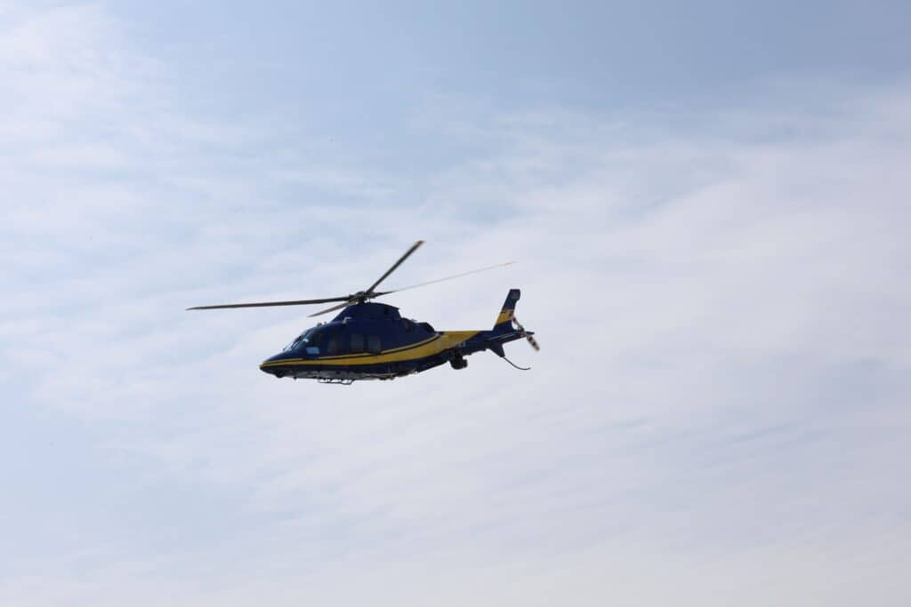 Photo by Tahir Xəlfəquliyev: https://www.pexels.com/photo/blue-and-yellow-helicopter-in-flight-against-sky-33996045/